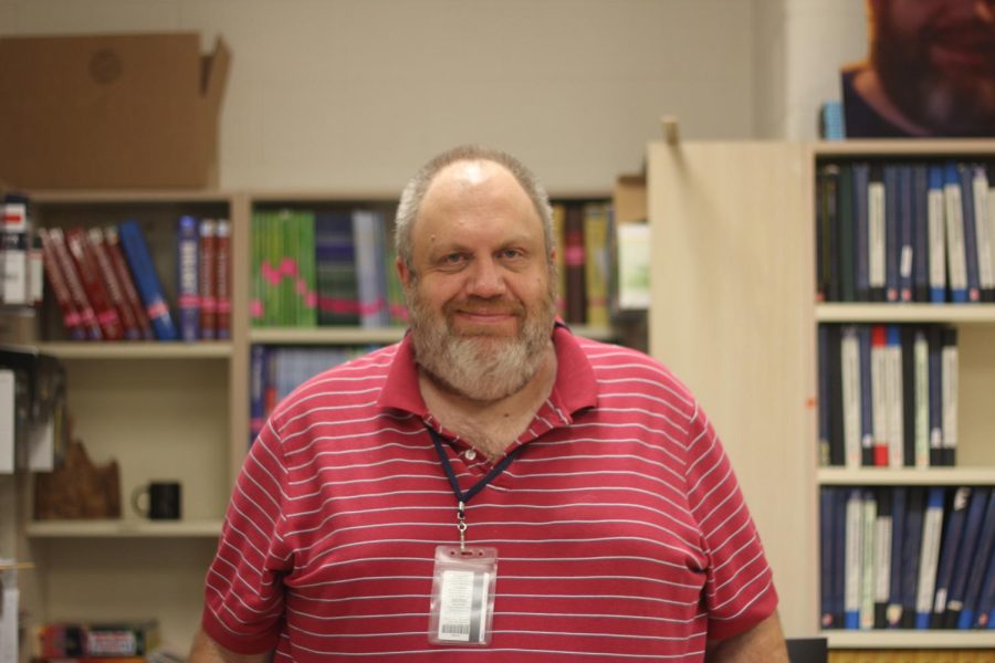 Mr. Haines, the in-house suspension coordinator smiles in the bookroom. 