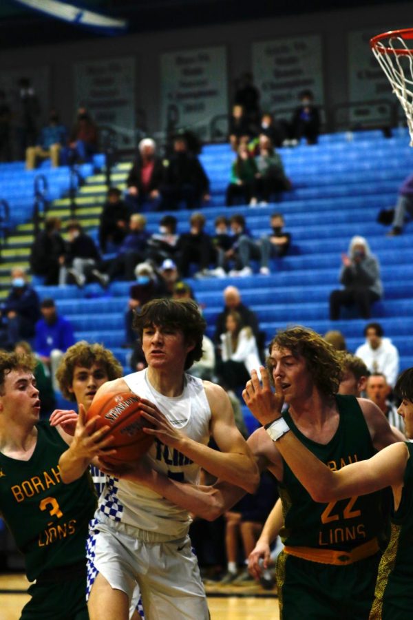 Timberline guard, Jachin Mertes(5) fights for the rebound!