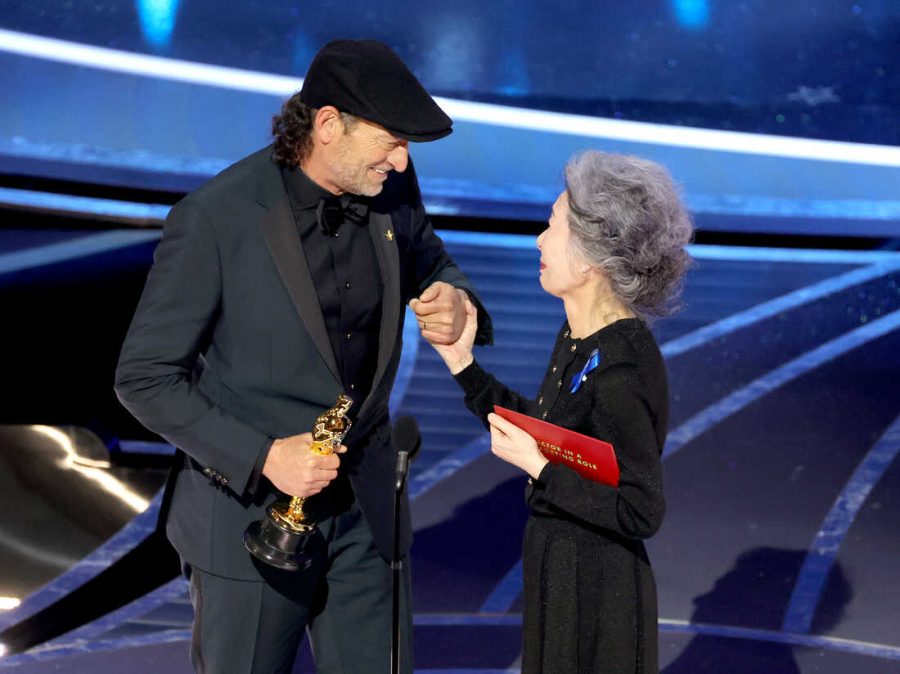 Troy Kotsur receiving his Oscar award for Best Supporting Actor.