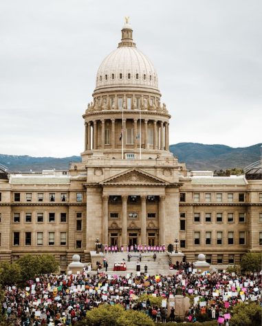 Protesters huddle outside the Idaho state capitol during the Bans off our Bodies march on Saturday, May 14. 