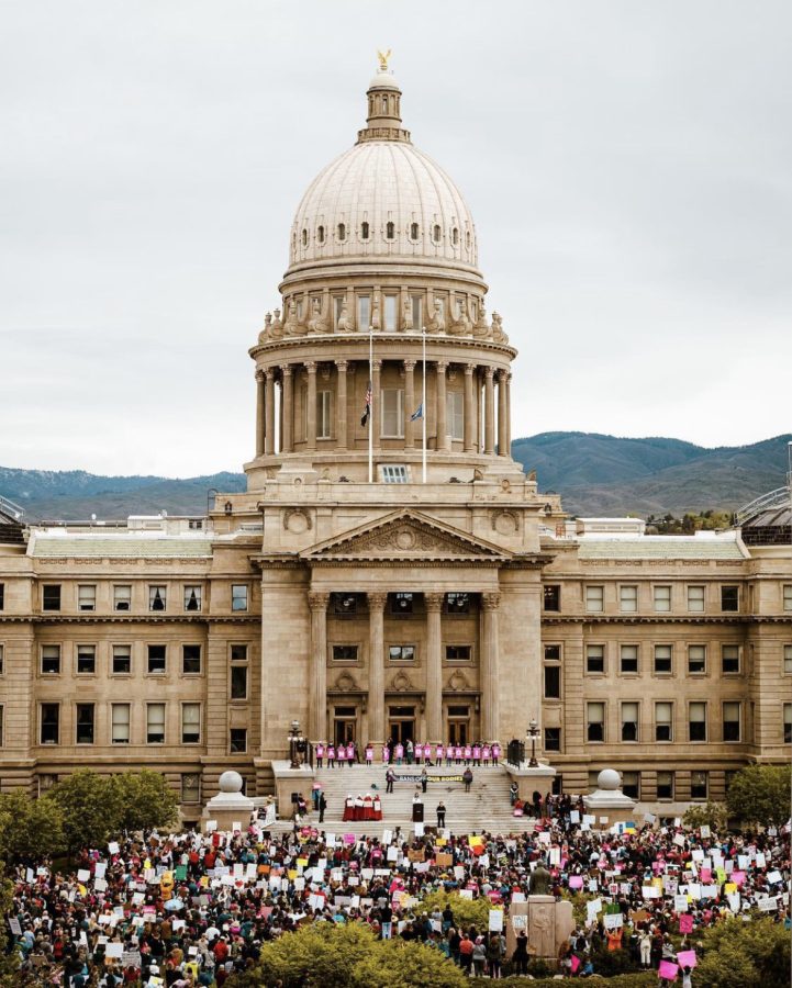 Protesters+huddle+outside+the+Idaho+state+capitol+during+the+Bans+off+our+Bodies+march+on+Saturday%2C+May+14.+