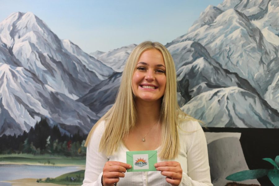 The winner of the parking spot poll, Alyssa Pike, smiling with her $35 Zero Six Coffee Fix gift card!