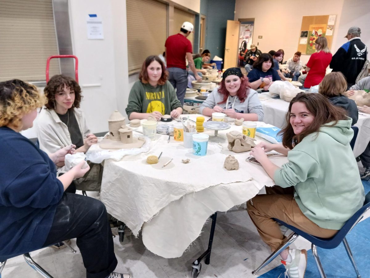 Talia Tzavalas (Junior), Annika Davis (Senior), Dee Bell (Senior), Kinsley Jones (Sophomore), and Sophia McDonald (Junior) at the ceramics table at art night