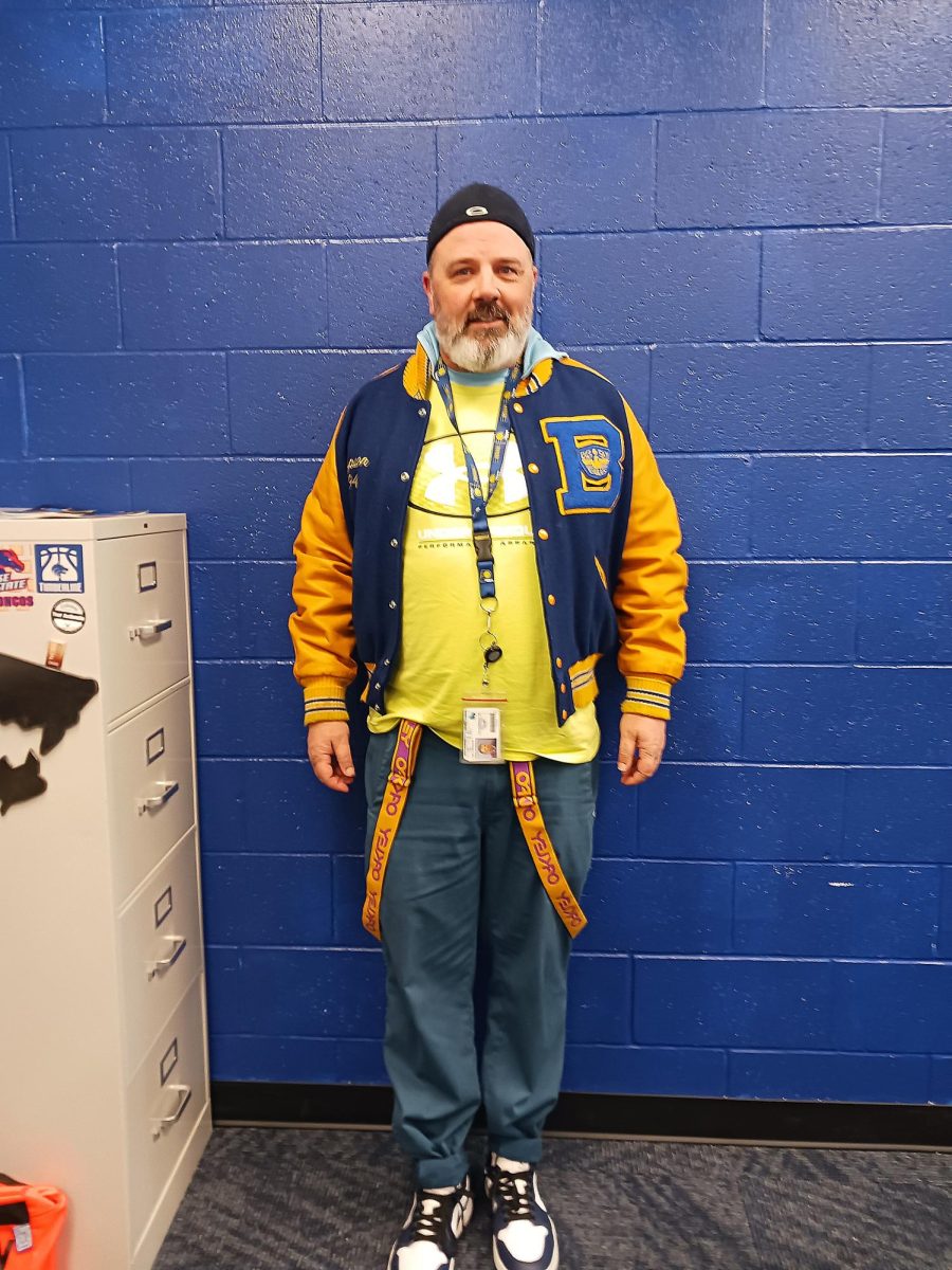 Mr. Simpson taking inspiration from his highschool years and his letterman jacket for Wednesday.