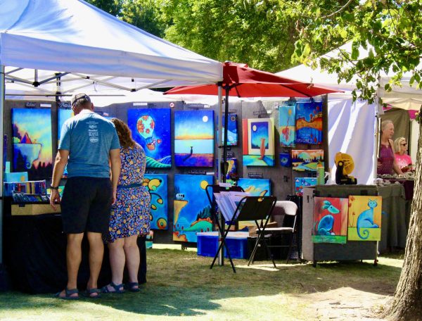 Booths selling paintings at Art in the park