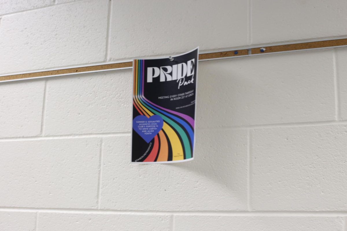 Pride club poster in hallway by the lockerooms