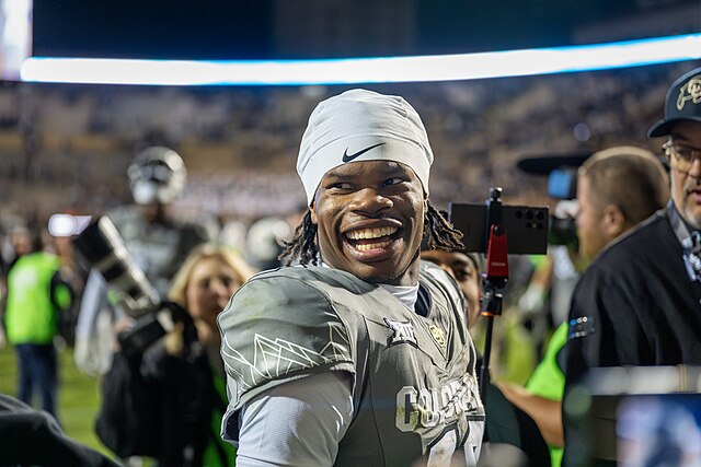 Travis Hunter talking in an interview during their match against Cincinnati Bearcats at Folsom Field. CC BY 2.0