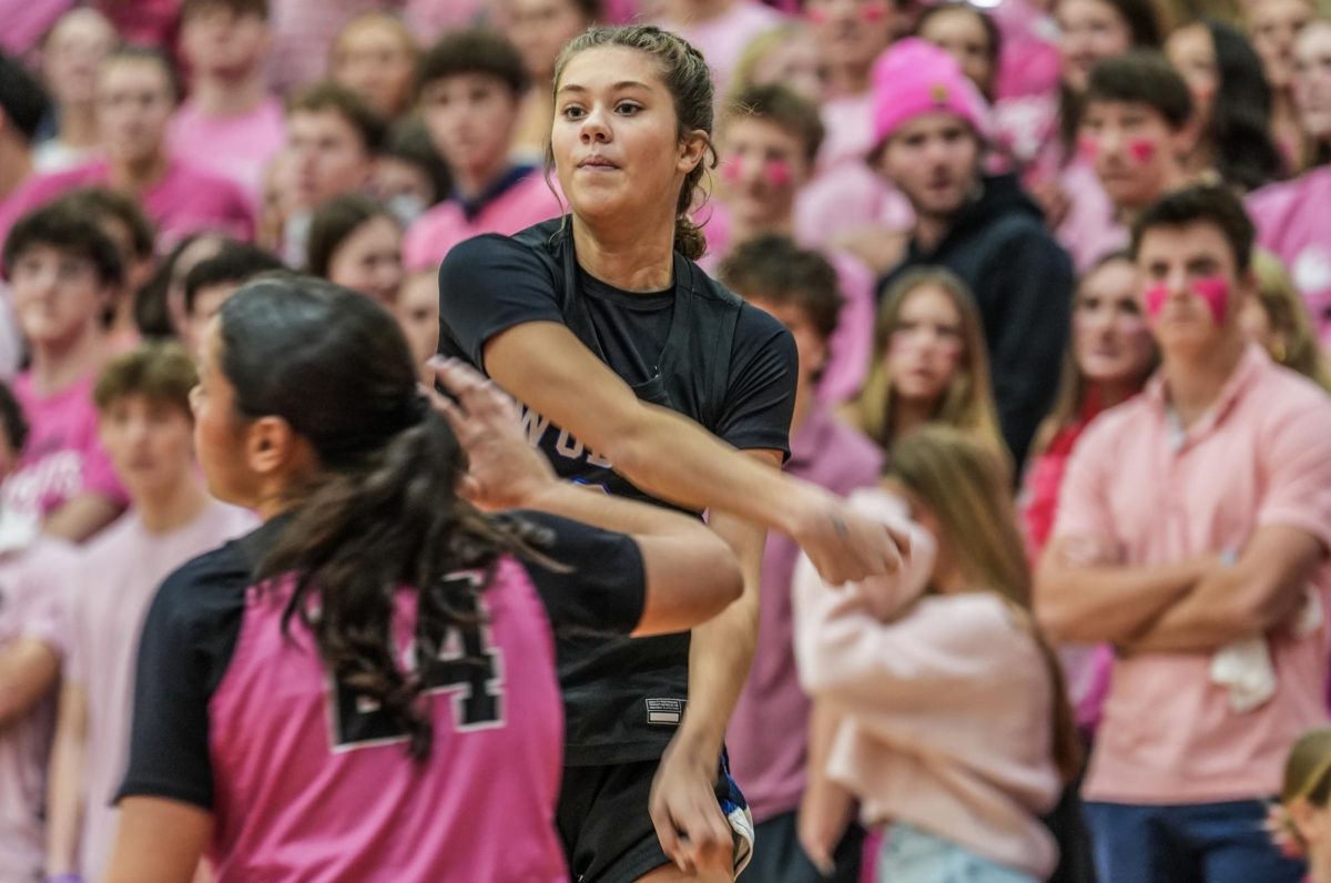 Ruby Kile (Sr.) passing the ball to the post.