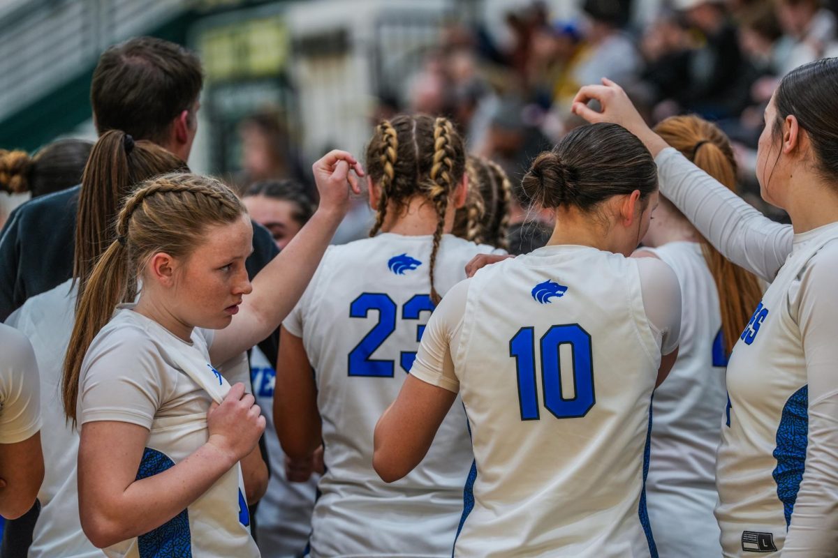 Coach Andy Jones and the girls’ varsity team’s last timeout huddle of the 24-25 season.