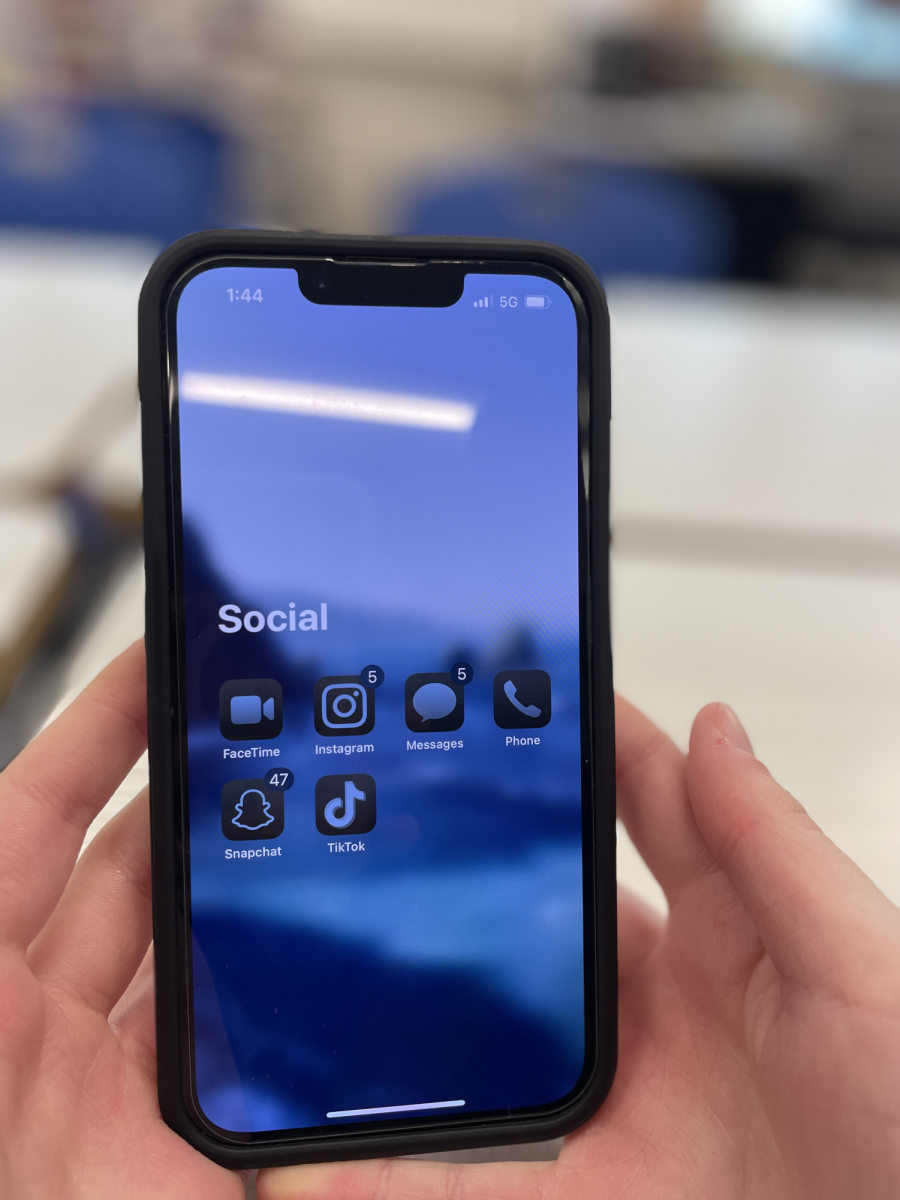 Social media apps displayed on an iPhone. 