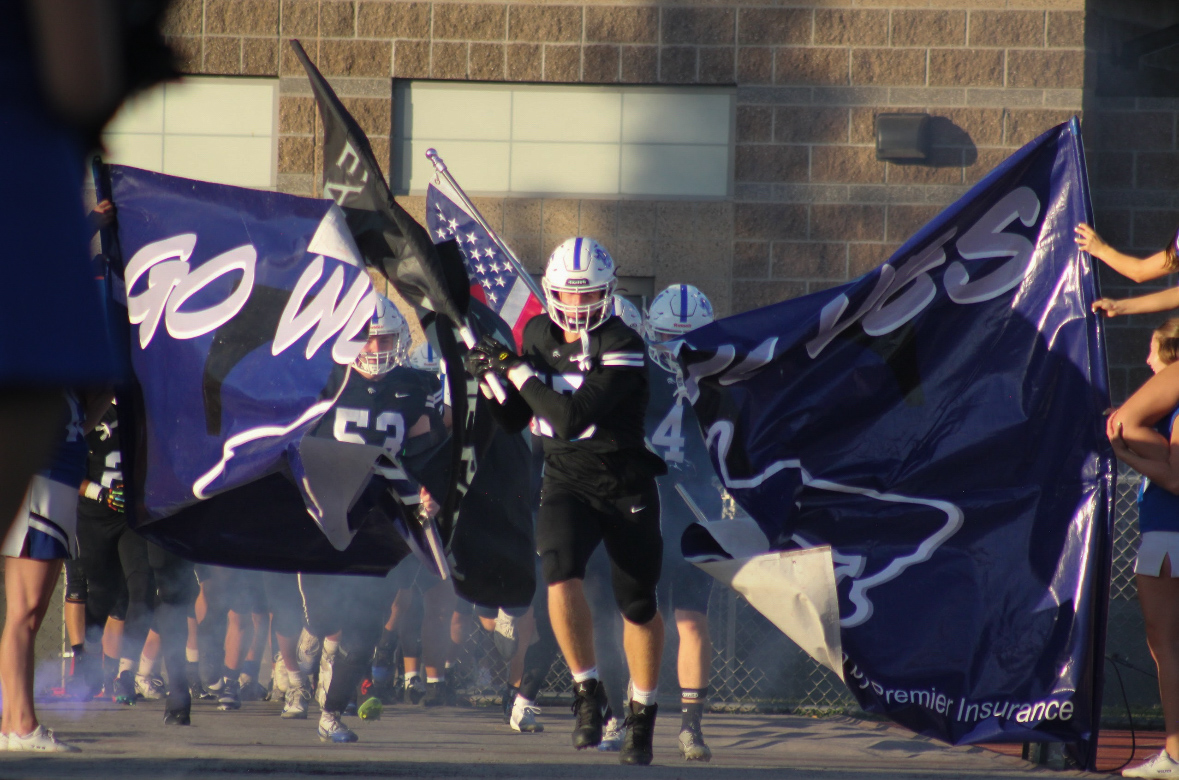 Andrew Price (Sr.) breaking the banner.