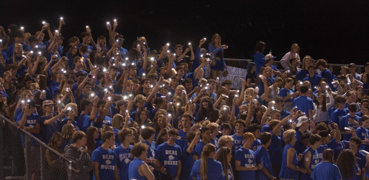 Timberline Student Section Waving their flashlights