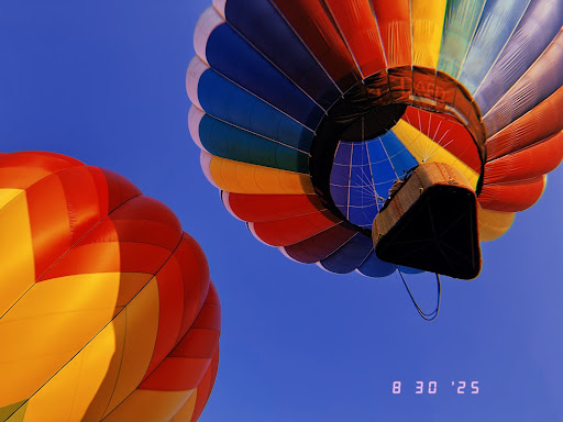 Looking up as colors fill the sky at Boise Balloon Festival.


