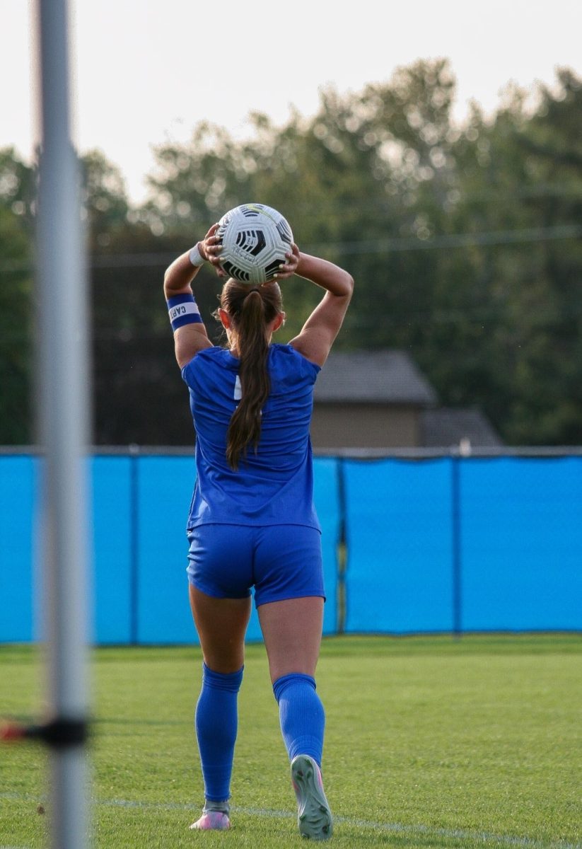 Maura Walters (Sr.) throwing the ball to her team.