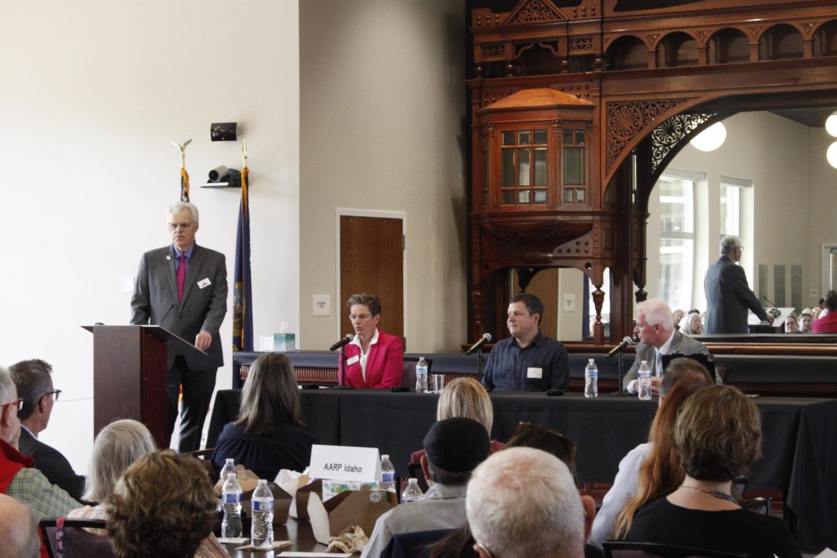 All three panelists and moderator answering questions from the audience