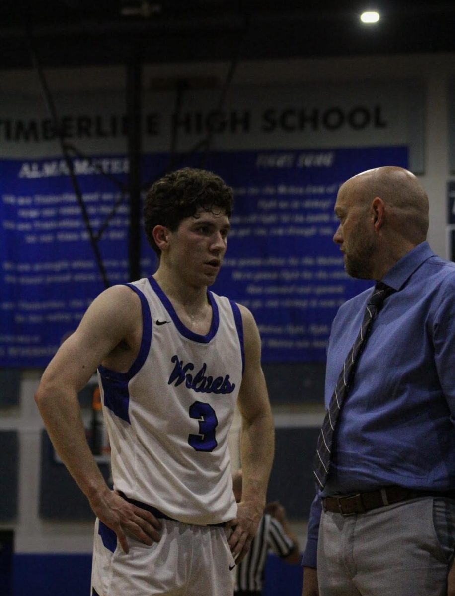 JD Focarile (Sr.) talking to his coach. 