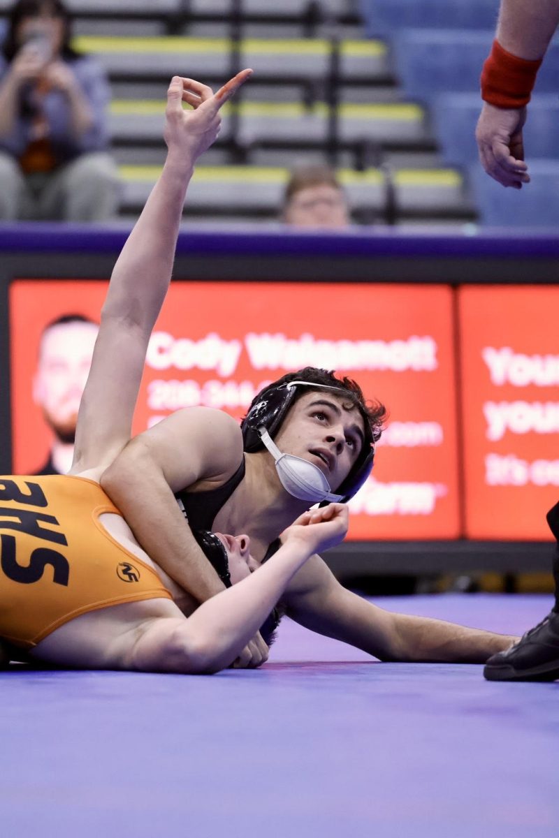 Benji Martinez (Sr.) pinning his opponent. 