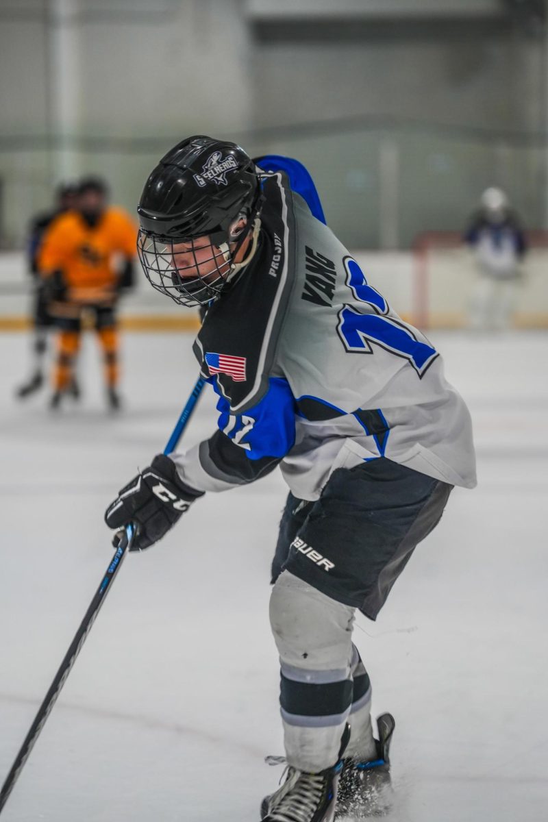 Derek Yang handles the puck. 