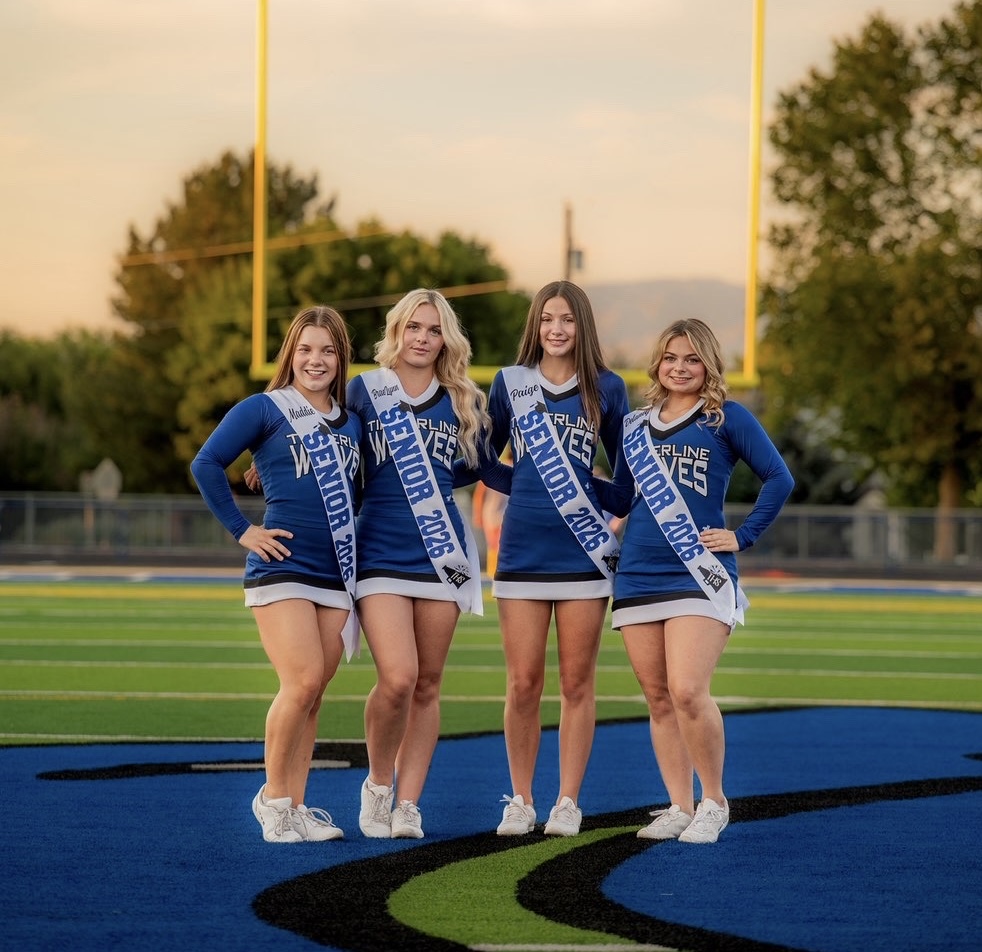 Cheer seniors posing for senior photos.